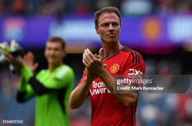 Jonny Evans of Manchester United applauds the crowd during the pre-season friendly match between Manchester United and Olympique Lyonnais at BT...