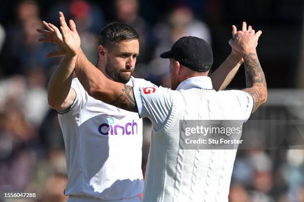 Chris Woakes of England celebrates taking the wicket of Cameron Green of Australia with teammate Ben Stokes of England during Day One of the LV=...