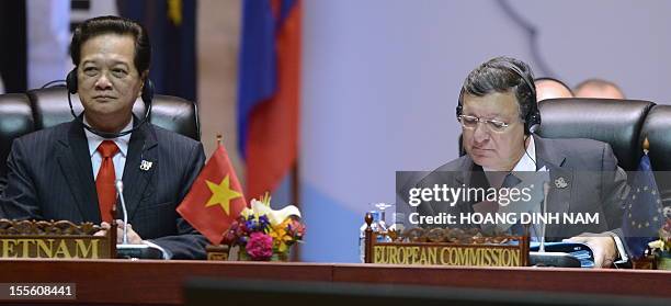 Vietnamese Prime Minister Nguyen Tan Dung sits next to President of the European Commission Jose Manuel Barroso as they attend a plenery session of...