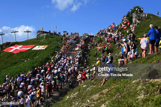 General view of the peloton climbing to the Col de la Loze while fans cheer during the stage seventeen of the 110th Tour de France 2023 a 165.7km at...