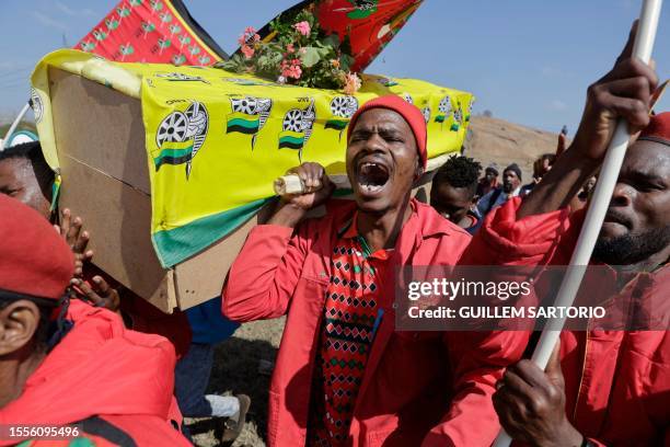 Economic Freedom Fighters supporters carry a mock coffin covered with an African National Congress flag at the EFF Birthday Rally, celebrating the...