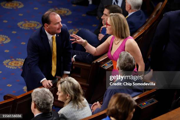 Sen. Mike Lee talks with Sen. Kyrsten Sinema before Israeli President Isaac Herzog addresses a joint meeting of the U.S. Congress at the U.S. Captiol...