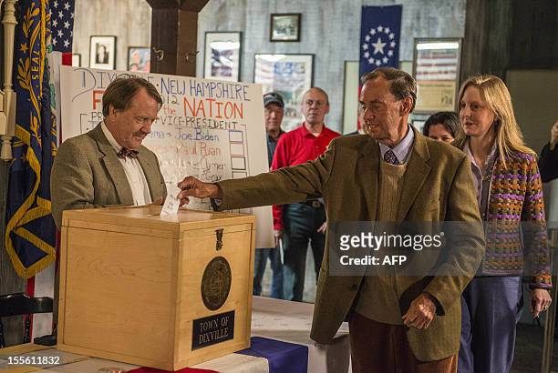 Man casts his ballot inside a polling station just after midnight on November 6, 2012 in Dixville Notch, New hampshire, the very first voting to take...