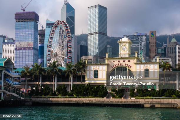 cityscape view of skyscrapers on hong kong island - tsim sha tsui stock pictures, royalty-free photos & images