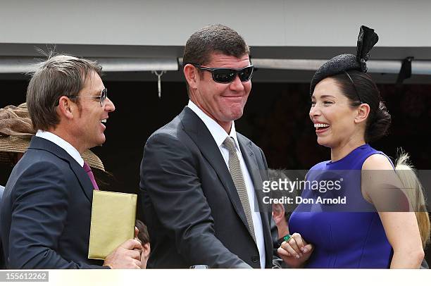 Shane Warne, James Packer and Erica Packer share a laugh in the Crown marquee at the Melbourne Cup at Flemington Racecourse on November 6, 2012 in...