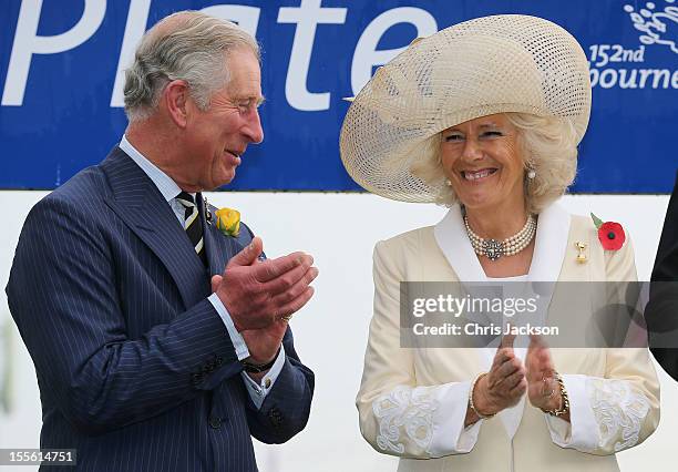 Camilla, Duchess of Cornwall and Prince Charles, Prince of Wales share a joke as they attend the 2012 Melbourne Cup at Flemington Racecourse on...