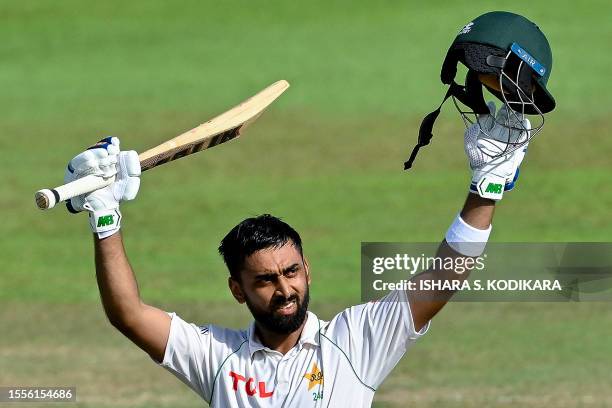 Pakistan's Abdullah Shafique celebrates after scoring double centuries during the third day of the second and final cricket Test match between...