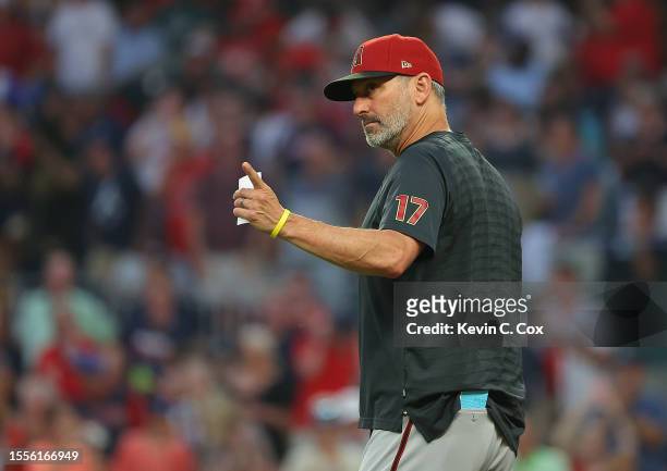 Manager Torey Lovullo of the Arizona Diamondbacks points to the bullpen as he walks to the mound to pull Zach Davies in the fourth inning against the...