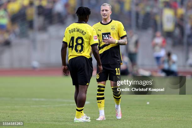 Paul Besong speaks with Marco Reus of Dortmund during the pre-season friendly match between Rot-Weiß Oberhausen and Borussia Dortmund at...