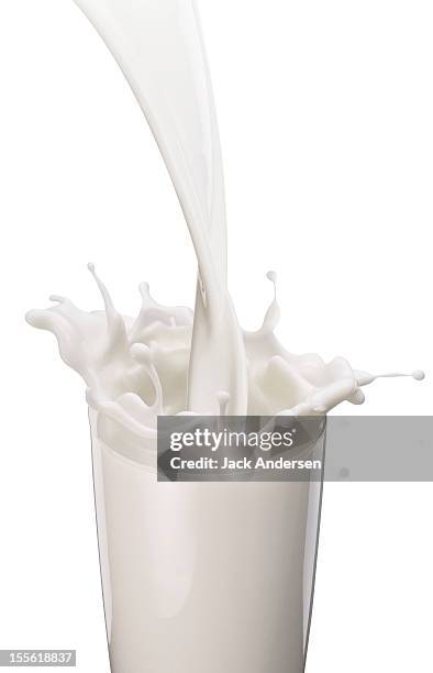 milk splash - glass of milk stock pictures, royalty-free photos & images