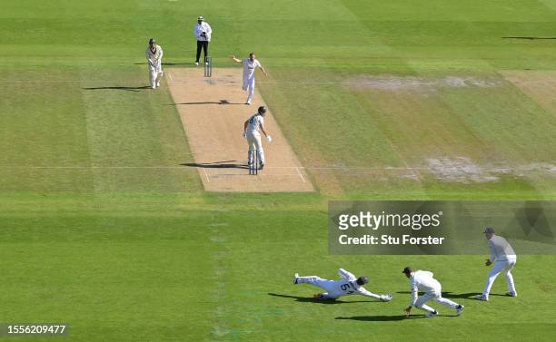 England wicketkeeper Jonny Bairstow dives to catch out Mitchell Marsh off the bowling off Chris Woakes during day one of the LV= Insurance Ashes 4th...
