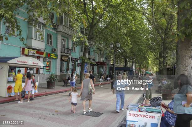 People walk on the streets as Russia-Ukraine war continues in Crimea on July 25, 2023. Car ferries departing from Kavkaz Port of Krasnodar to the...