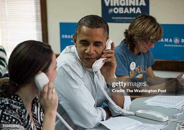 President Barack Obama flanked by Suzanne Stern and Alexa Kissinger takes time out to visit the Organizing or America field office where he made...