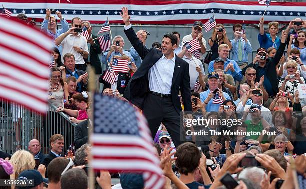 Rep Paul Ryan waves to supporters after accepting a running mate position from Republican presidential candidate and former Massachusetts Governor...