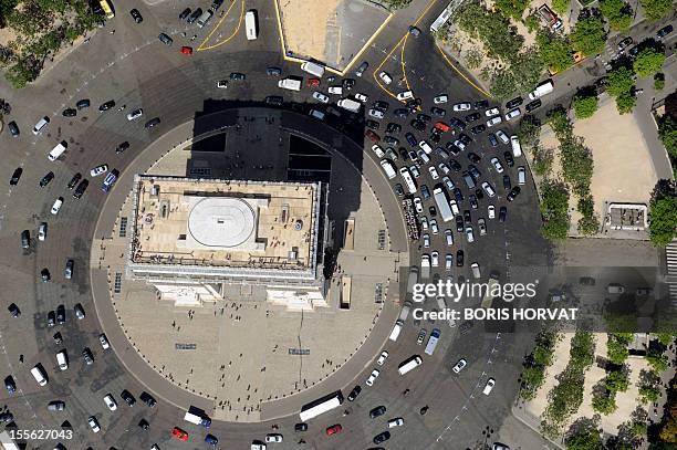 An aerial picture taken aboard an helicopter on July 20, 2010 shows a view of the Arc de triomphe in Paris. AFP PHOTO BORIS HORVAT