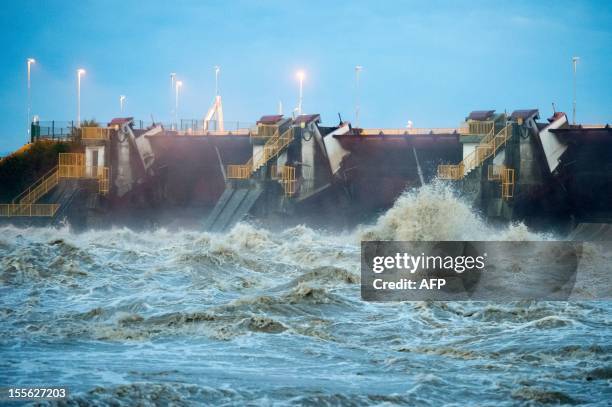 This picture taken on November 6, 2012 shows the Markovci dam, across the flooded Drava river, in Markovci, some 40 km south of Maribor as Slovenian...