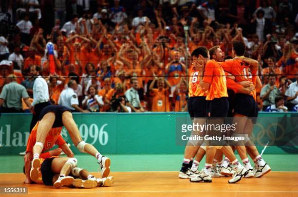 The Dutch team celebrate their gold medal win over Italy during the mens Volleyball final at the Olympic Games at the Omni Coliseum in Atlanta,...