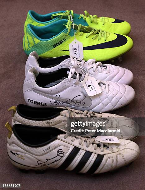 Pairs of football boots worn by Didier Drogba, Fernando Torres and Frank Lampard are shown at Sotheby's on November 6, 2012 in London, England....