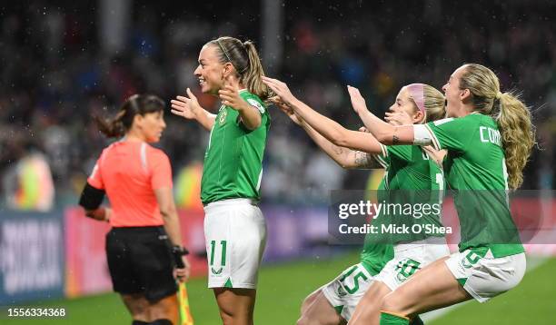 Perth , Australia - 26 July 2023; Katie McCabe of Republic of Ireland, left, celebrates with teammates Denise O'Sullivan and Megan Connolly, after...
