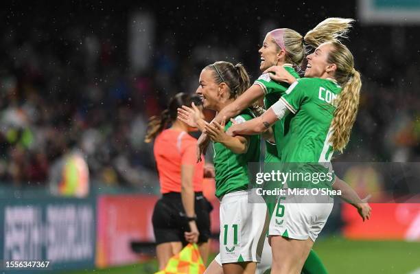 Perth , Australia - 26 July 2023; Katie McCabe of Republic of Ireland, left, celebrates with teammates Denise O'Sullivan and Megan Connolly, after...