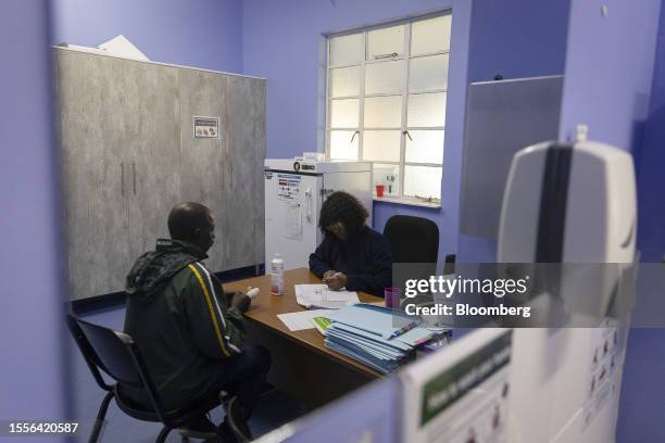 Nurse speaks with a patient in a consulting room at the Sonop Clinic, a government medical facility expanded and partially equipped by...