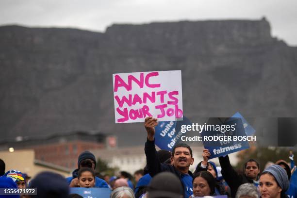 Supporters of the Democratic Alliance , South Africa's main opposition party, prepare to march through the city streets to protest against the ruling...