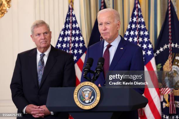 President Joe Biden, joined by Agriculture Secretary Tom Vilsack , delivers remarks at a meeting of his Competition Council in the State Dinning Room...