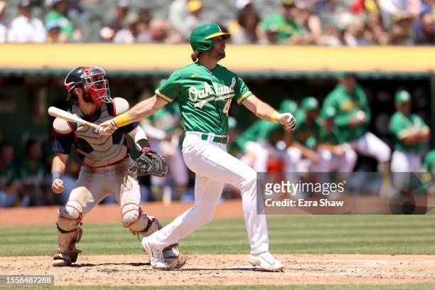 Cody Thomas of the Oakland Athletics hits his first Major League home run in the second inning of their game against the Boston Red Sox at...