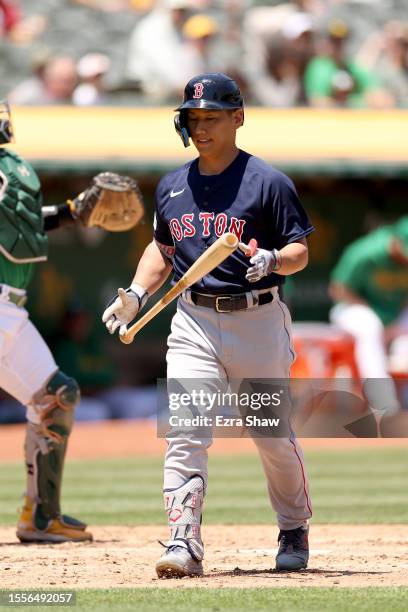 Masataka Yoshida of the Boston Red Sox walks back to the dugout after striking out against the Oakland Athletics in the third inning at RingCentral...