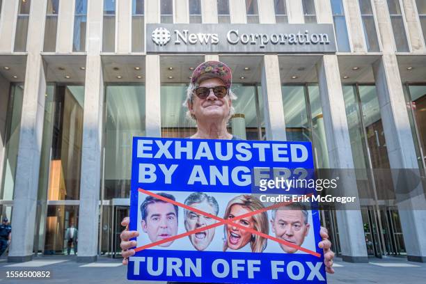 Participant seen holding a sign outside Fox News HQ. In the aftermath of the settlement with Dominion Voting Systems and in anticipation of the...