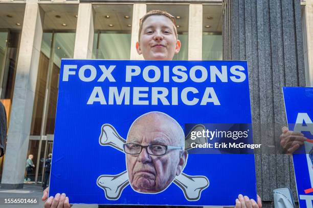 Participant seen holding a sign outside Fox News HQ. In the aftermath of the settlement with Dominion Voting Systems and in anticipation of the...