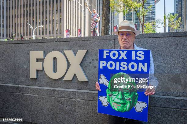 Participant seen holding a sign outside Fox News HQ. In the aftermath of the settlement with Dominion Voting Systems and in anticipation of the...