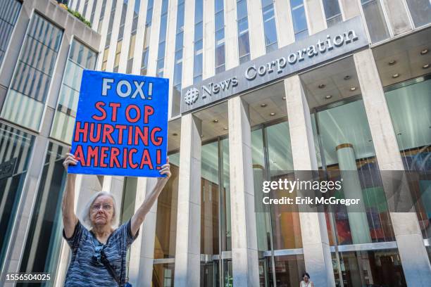 Participant seen holding a sign outside Fox News HQ. In the aftermath of the settlement with Dominion Voting Systems and in anticipation of the...