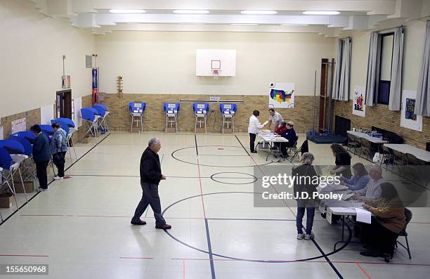 Voters cast their ballots at an elementary school on November 6, 2012 in Bowling Green, Ohio. Voting is underway in the US presidential election in...