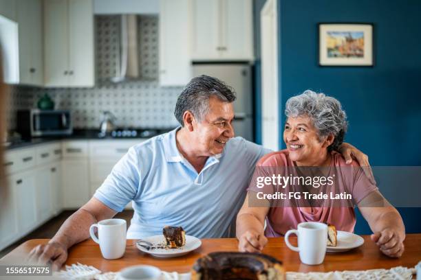 senior couple having breakfast at home - mexican sweets stock pictures, royalty-free photos & images