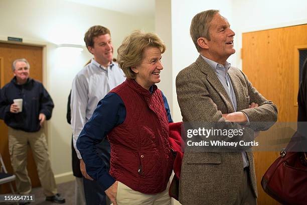 Senate candidate, Rep. Todd Akin , his wife, Lulli Akin, and son, Wynn Akin, wait in line to vote November 6, 2012 in Wildwood, Missouri. Akin, who...