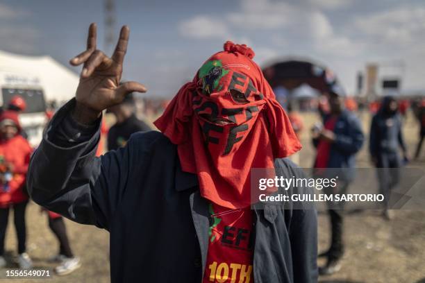 An Economic Freedom Fighters supporter gestures at the EFF Birthday Rally, celebrating the 10th anniversary of the party, in Marikana on July 26,...