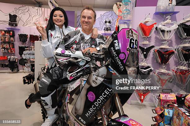 Fifth-time Paris-Dakar moto competitor, French amator Hugo Payen , poses in a Dorcelstore on November 19, 2011 in Saint-Herblain near the western...