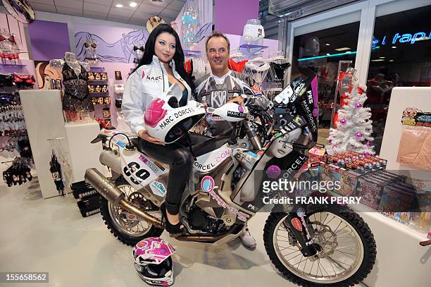 Fifth-time Paris-Dakar moto competitor, French amator Hugo Payen , poses in a Dorcelstore on November 19, 2011 in Saint-Herblain near the western...