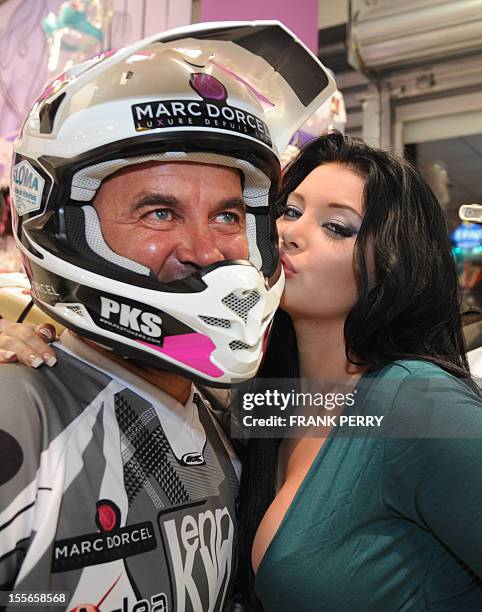 Fifth-time Paris-Dakar moto competitor, French amator Hugo Payen , poses in a Dorcelstore on November 19, 2011 in Saint-Herblain near the western...