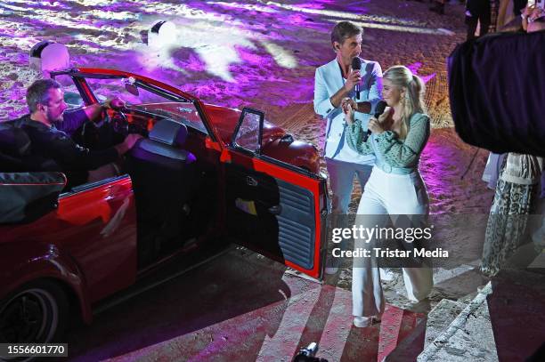 In this photo released on July 26 Florian Silbereisen and Beatrice Egli perform during the Schlager tv show "Die grosse Schlagerstrandparty - Wir...