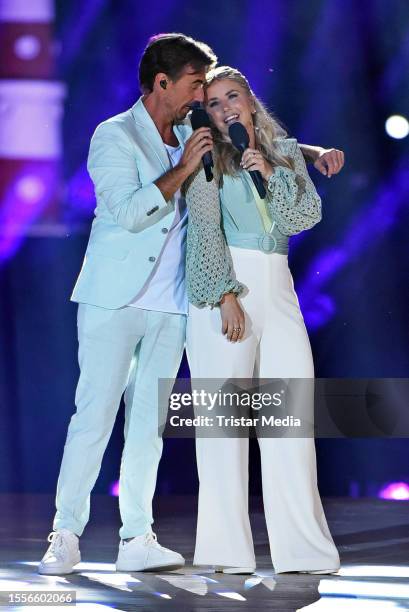 In this photo released on July 26 Florian Silbereisen and Beatrice Egli perform during the Schlager tv show "Die grosse Schlagerstrandparty - Wir...