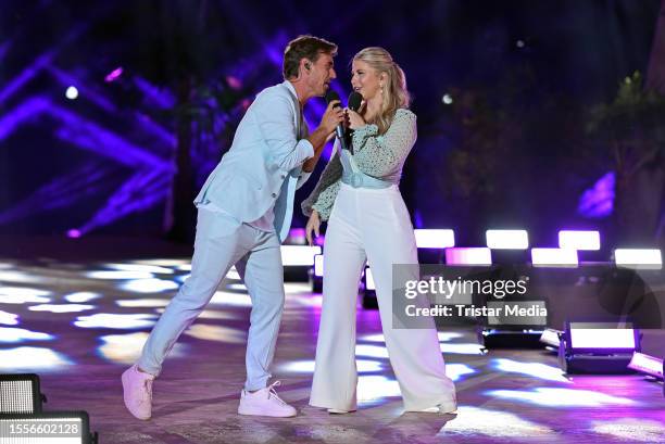 In this photo released on July 26 Florian Silbereisen and Beatrice Egli perform during the Schlager tv show "Die grosse Schlagerstrandparty - Wir...