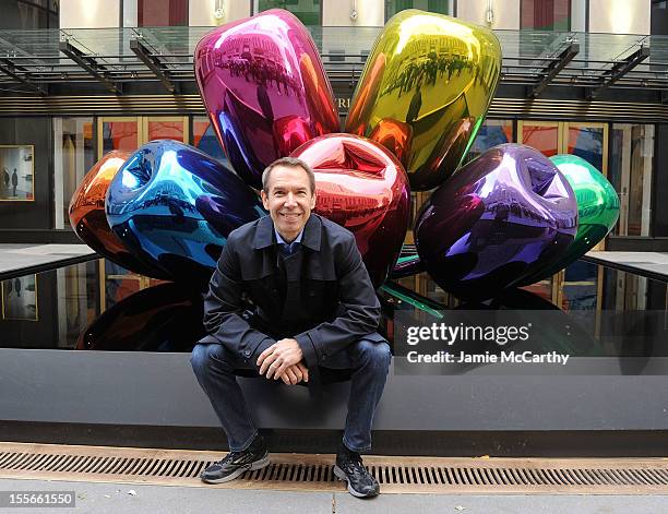 Artist Jeff Koons poses with his sculpture "Tulips" in front of Christie's at Rockefeller Plaza on November 6, 2012 in New York City.