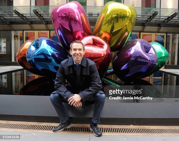 Artist Jeff Koons poses with his sculpture "Tulips" in front of Christie's at Rockefeller Plaza on November 6, 2012 in New York City.