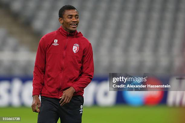 Salomon Kalou smiles during a OSC Lille training session ahead of their UEFA Champions League group F match against FC Bayern Muenchen at the Allianz...