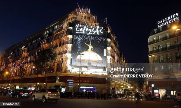 View of the illuminated facade of the Galeries Lafayette department store in Paris, taken on November 6 after the inauguration of the store's...