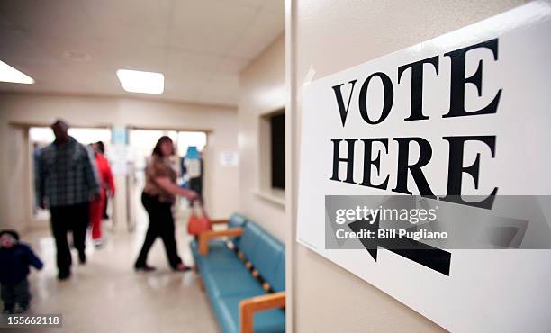 Citizens vote in the presidential election at the Owen Jax Recreation Center November 6, 2012 in Warren, Michigan. The race between Democratic...