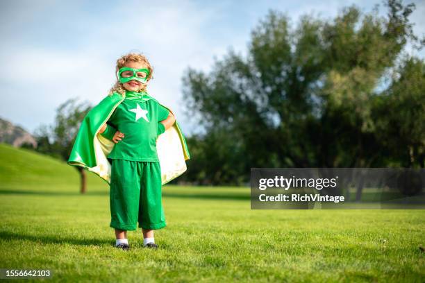 little girl superhero - green cape stock pictures, royalty-free photos & images