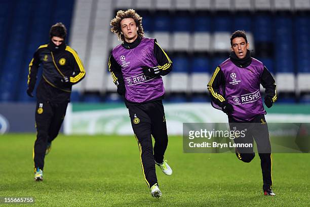 Oscar, David Luiz and Paulo Ferreira attend a Chelsea Training Session and Press Conference ahead of tomorrow's UEFA Champion's League match between...